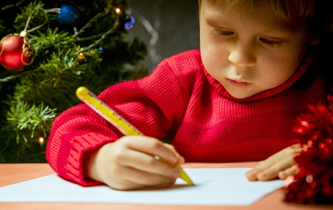 Boy writing letter to Santa
